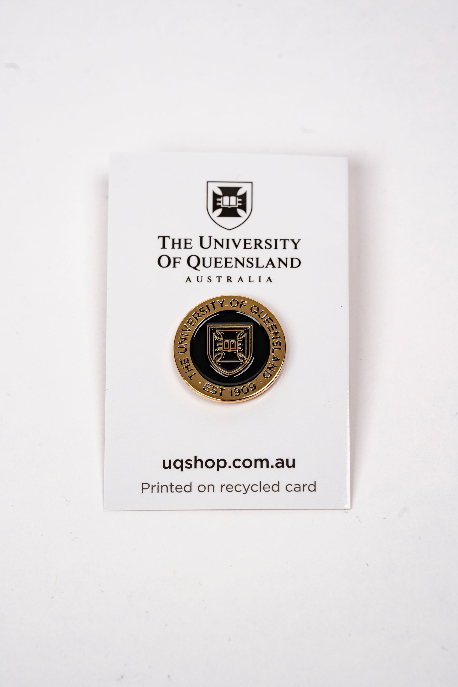 UQ Shield Pin Black/Gold